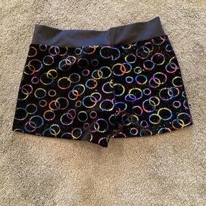 Large child, black and rainbow shorts, no brand